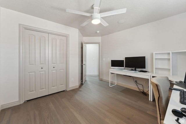 office featuring ceiling fan, baseboards, and wood finished floors