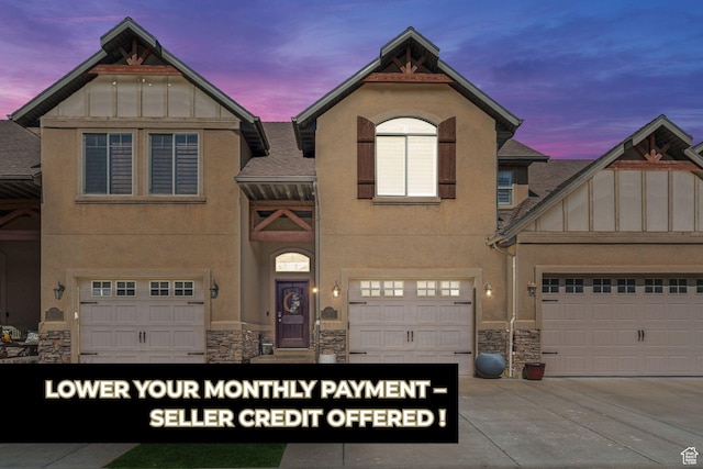 4495 S Stone Creek Rd Unit D22, West Haven, UT 84401 - view of front of home with driveway, stucco siding, and stone siding