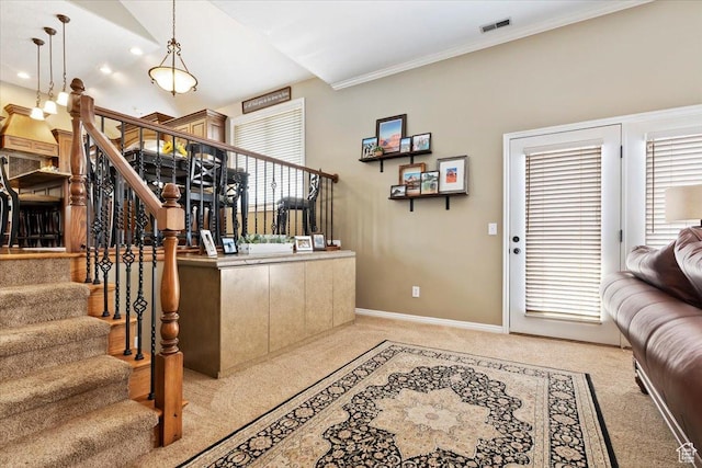 bar with visible vents, baseboards, light carpet, and stairs
