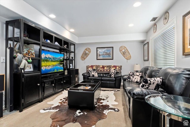 living area with carpet, visible vents, and recessed lighting