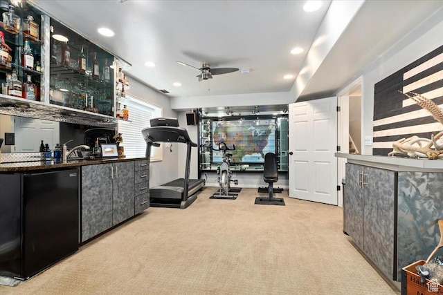 workout area featuring recessed lighting, carpet floors, wet bar, and ceiling fan