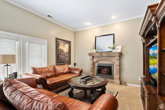 living area with a glass covered fireplace, visible vents, light colored carpet, and crown molding
