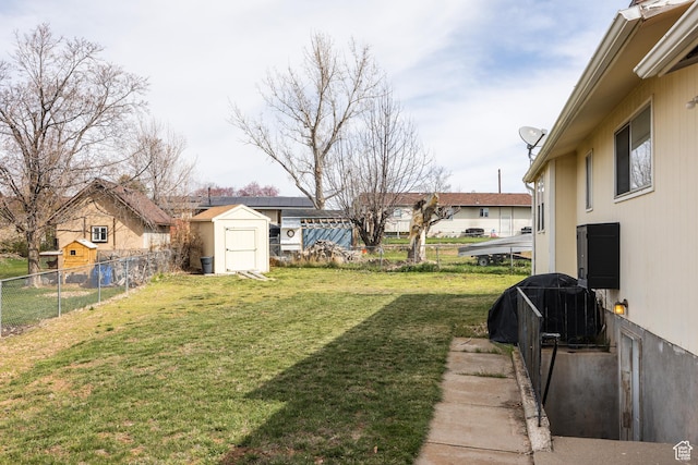 1083 N 1250 W, Layton, UT 84041 - view of yard featuring an outbuilding, a fenced backyard, and a shed
