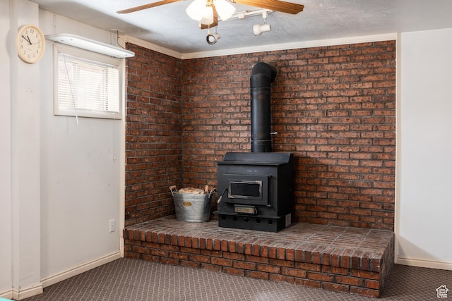 1083 N 1250 W, Layton, UT 84041 - room details with a wood stove, carpet flooring, baseboards, and a ceiling fan