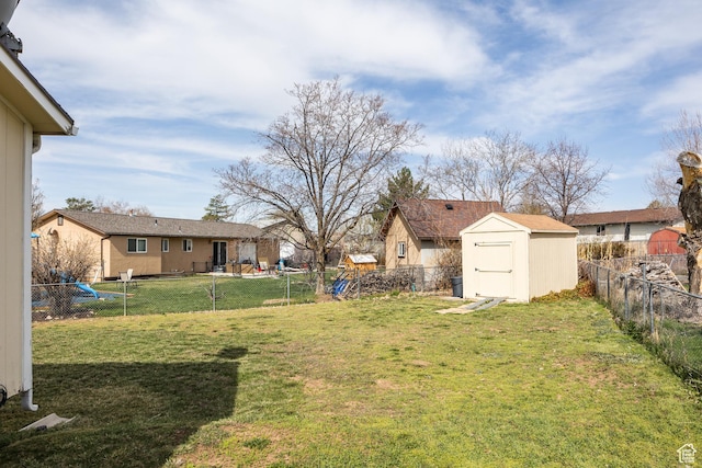 1083 N 1250 W, Layton, UT 84041 - view of yard featuring a shed, a fenced backyard, an outdoor structure, and a playground