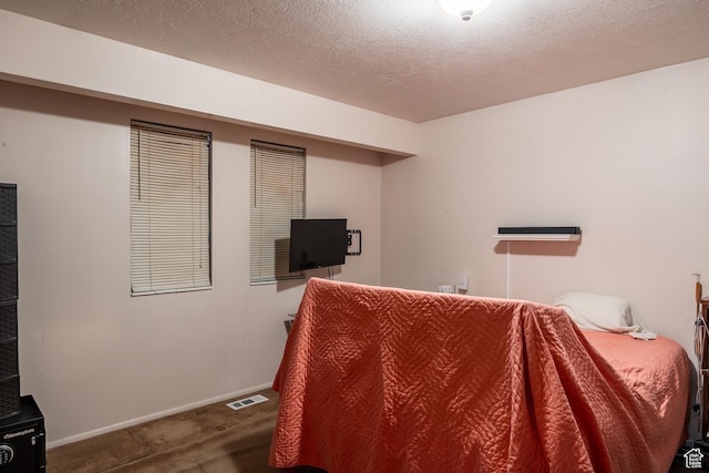 1083 N 1250 W, Layton, UT 84041 - carpeted bedroom with visible vents, a textured ceiling, and baseboards