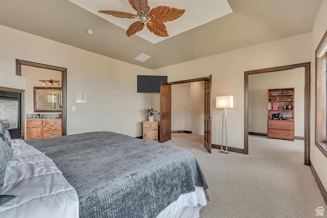 bedroom with light carpet and baseboards