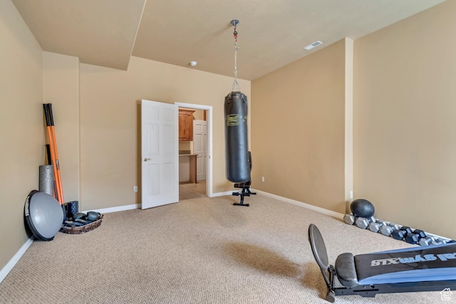 workout room featuring visible vents, baseboards, and carpet floors