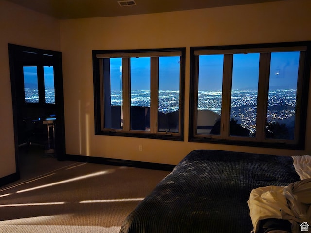 bedroom with visible vents, baseboards, and carpet