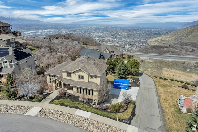 drone / aerial view featuring a mountain view