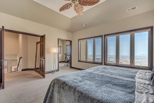 bedroom featuring visible vents, baseboards, and light colored carpet