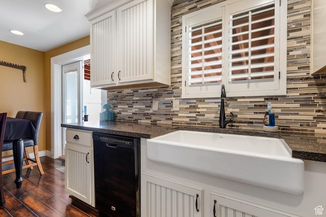 395 Fairlane Dr, Tooele, UT 84074 - kitchen with tasteful backsplash, dark wood-style flooring, baseboards, dishwasher, and a sink