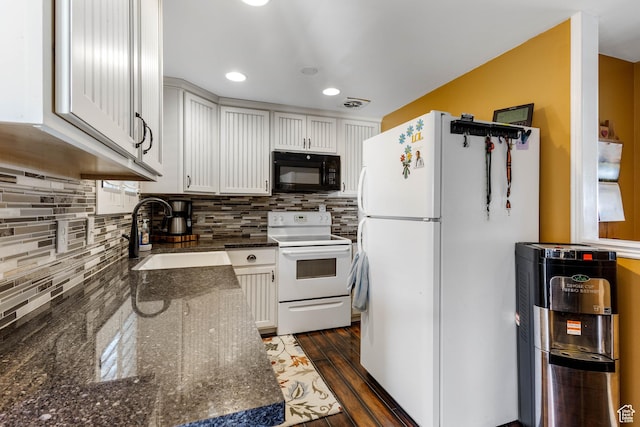395 Fairlane Dr, Tooele, UT 84074 - kitchen featuring tasteful backsplash, a sink, white appliances, white cabinetry, and dark stone counters