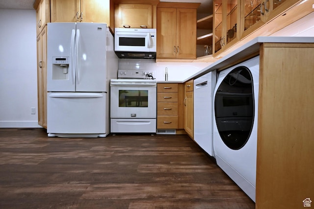 kitchen featuring backsplash, light countertops, white appliances, and dark wood finished floors