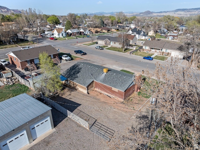 birds eye view of property with a residential view and a mountain view