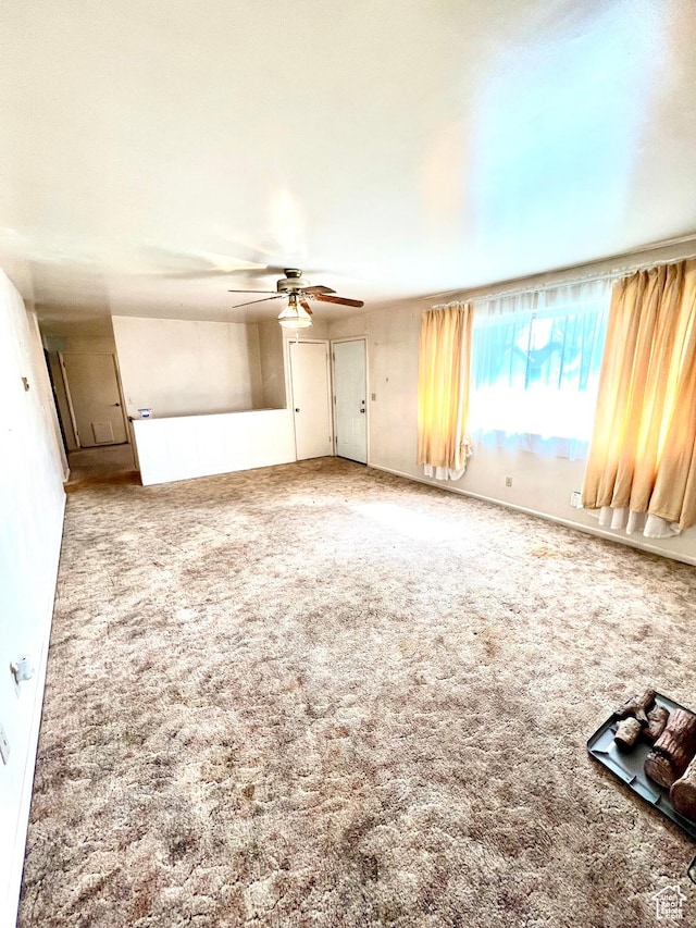 carpeted empty room with ceiling fan