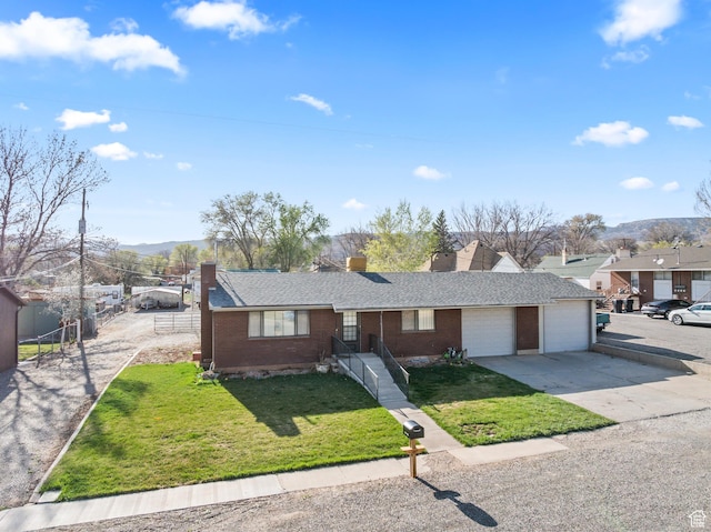 view of front of house featuring fence, a front lawn, a chimney, a garage, and driveway