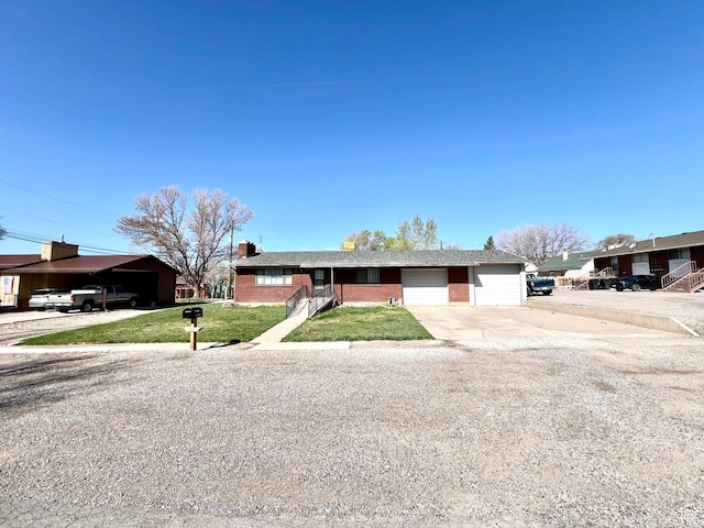 ranch-style home with a front lawn, a garage, and a chimney
