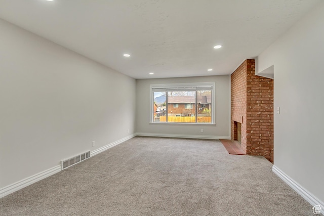 980 Hudson St, Ogden, UT 84404 - unfurnished living room featuring visible vents, baseboards, carpet, a fireplace, and recessed lighting
