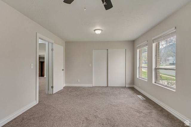 980 Hudson St, Ogden, UT 84404 - unfurnished bedroom with carpet, a closet, baseboards, and a ceiling fan