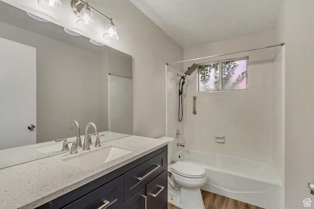 980 Hudson St, Ogden, UT 84404 - full bath with toilet, bathtub / shower combination, vanity, and wood finished floors