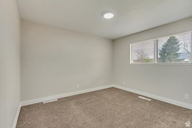 980 Hudson St, Ogden, UT 84404 - carpeted empty room featuring visible vents and baseboards