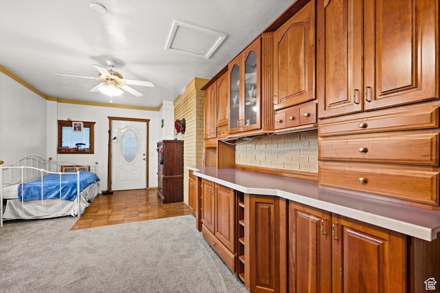 146 W 400 S, Tooele, UT 84074 - kitchen featuring light carpet, glass insert cabinets, brown cabinetry, and ceiling fan