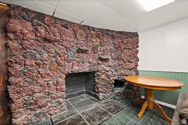 146 W 400 S, Tooele, UT 84074 - room details featuring a fireplace, a paneled ceiling, baseboards, and wainscoting