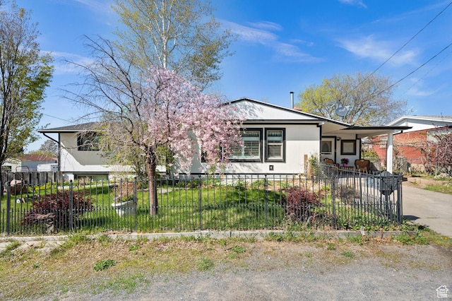 146 W 400 S, Tooele, UT 84074 - bungalow-style home featuring an attached carport, concrete driveway, and a fenced front yard