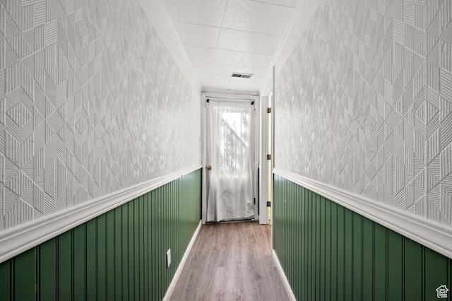 146 W 400 S, Tooele, UT 84074 - hallway featuring visible vents, crown molding, wainscoting, wood finished floors, and wallpapered walls