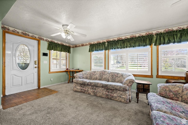 146 W 400 S, Tooele, UT 84074 - carpeted living room featuring a textured ceiling, baseboards, and a ceiling fan