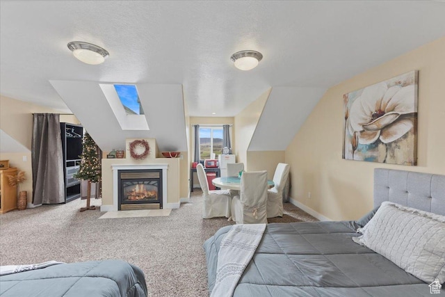 106 N Bear River Blfs, Preston, ID 83263 - bedroom with a skylight, a fireplace with flush hearth, carpet, and baseboards