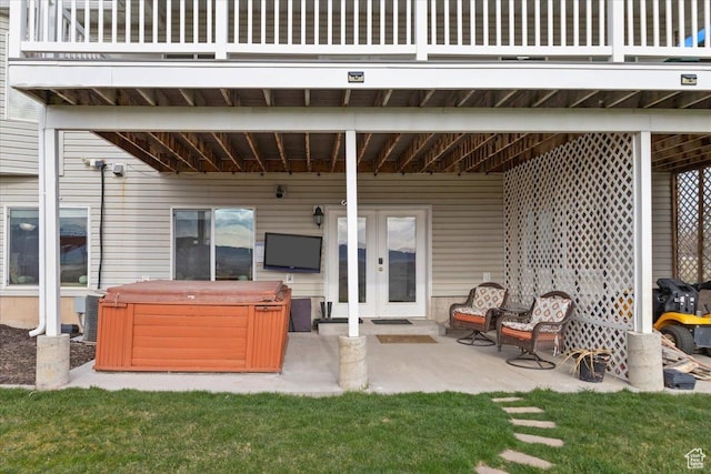 106 N Bear River Blfs, Preston, ID 83263 - view of patio / terrace featuring a hot tub, french doors, and a balcony