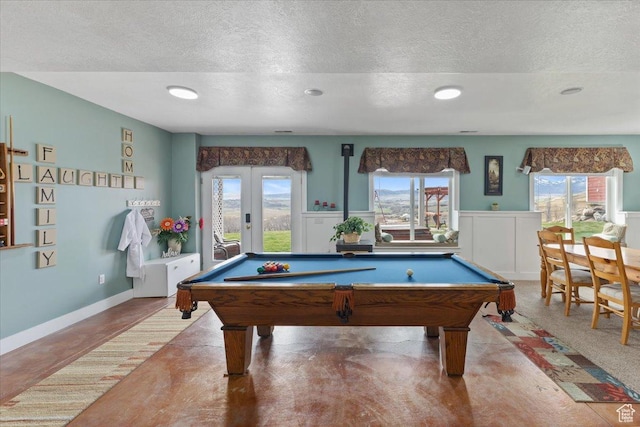 106 N Bear River Blfs, Preston, ID 83263 - game room with a textured ceiling, billiards, a wainscoted wall, and concrete flooring