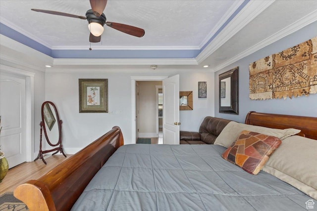 106 N Bear River Blfs, Preston, ID 83263 - bedroom with a raised ceiling, ornamental molding, baseboards, a ceiling fan, and wood finished floors