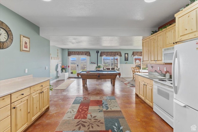 106 N Bear River Blfs, Preston, ID 83263 - kitchen with white appliances, finished concrete flooring, a sink, light brown cabinets, and light countertops