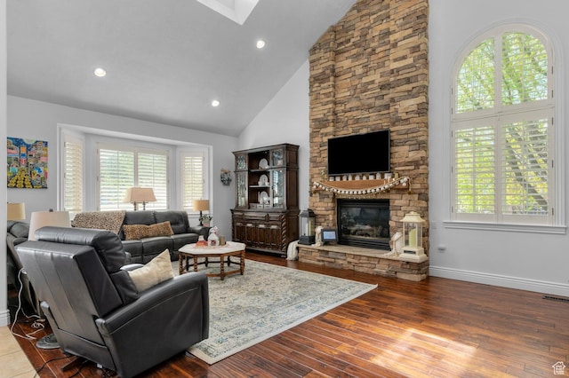 225 W 925 N, Centerville, UT 84014 - living area featuring a wealth of natural light, a stone fireplace, baseboards, and wood finished floors