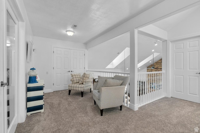 225 W 925 N, Centerville, UT 84014 - sitting room with carpet flooring, visible vents, and vaulted ceiling with skylight
