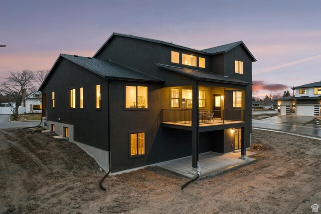 1514 E Livi Ln N Unit 10, Saratoga Springs, UT 84045 - back of house with stucco siding and a balcony
