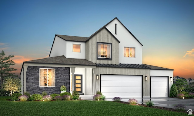 modern farmhouse style home featuring a yard, driveway, and a garage