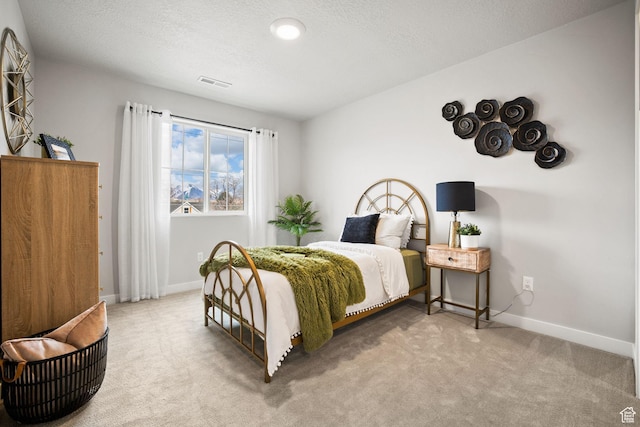 1514 E Livi Ln N Unit 10, Saratoga Springs, UT 84045 - bedroom featuring carpet flooring, baseboards, and a textured ceiling