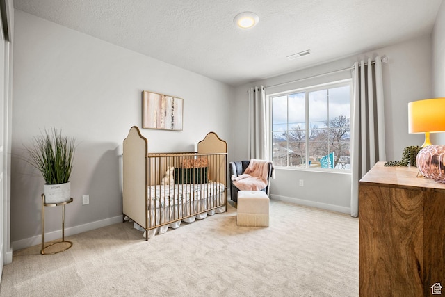 1514 E Livi Ln N Unit 10, Saratoga Springs, UT 84045 - bedroom featuring carpet floors, baseboards, and a textured ceiling