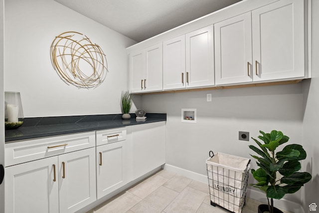 1514 E Livi Ln N Unit 10, Saratoga Springs, UT 84045 - laundry room with electric dryer hookup, cabinet space, washer hookup, baseboards, and light tile patterned flooring