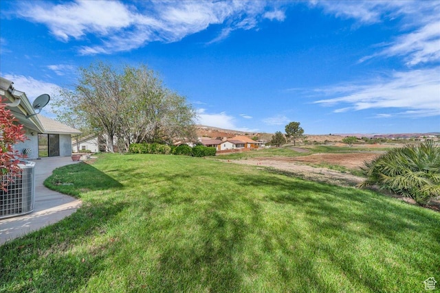 view of yard featuring central AC
