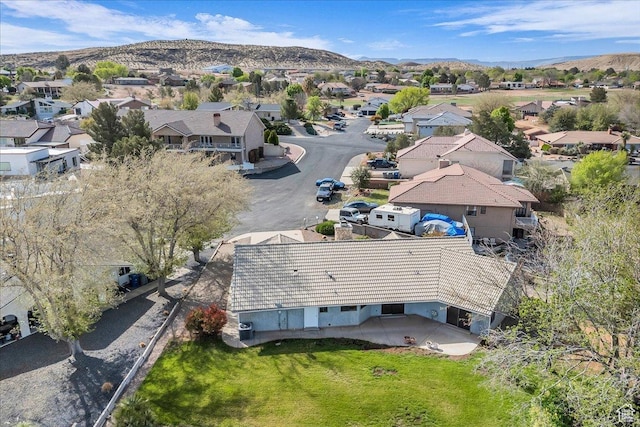 drone / aerial view with a residential view and a mountain view