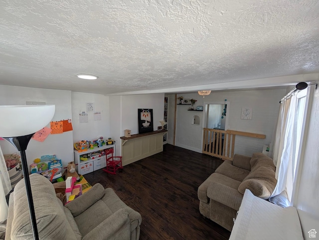 living area with wood finished floors and a textured ceiling