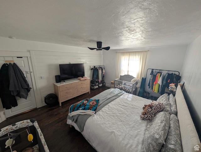 bedroom featuring a textured ceiling, wood finished floors, and ceiling fan