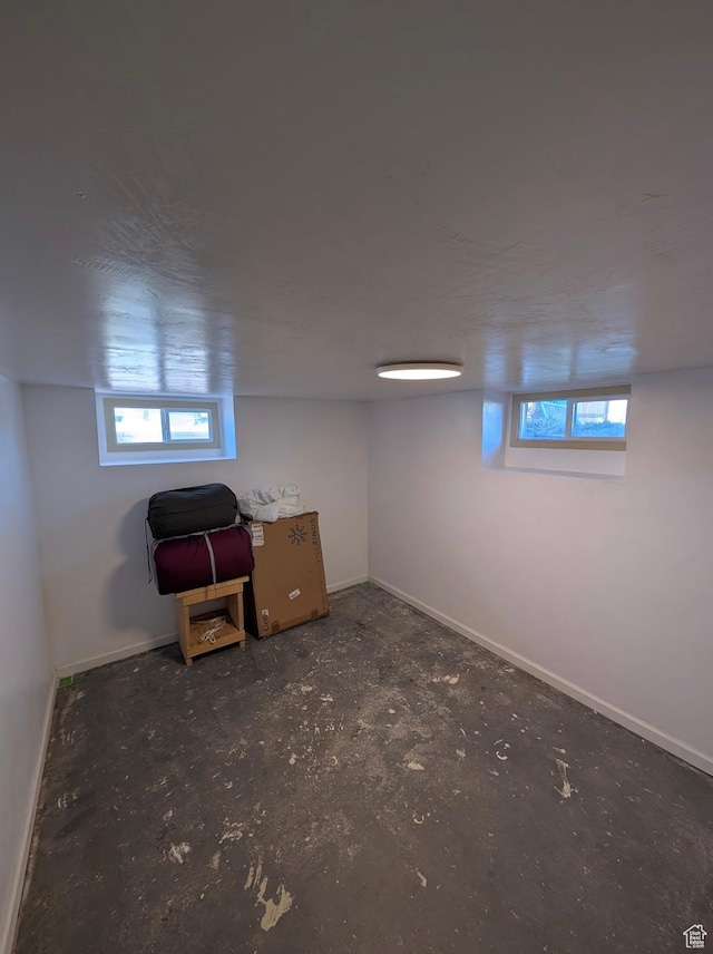 below grade area featuring baseboards and a wealth of natural light