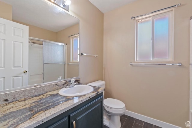 full bath featuring an enclosed shower, toilet, vanity, and baseboards