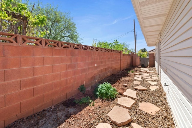 view of yard with a fenced backyard